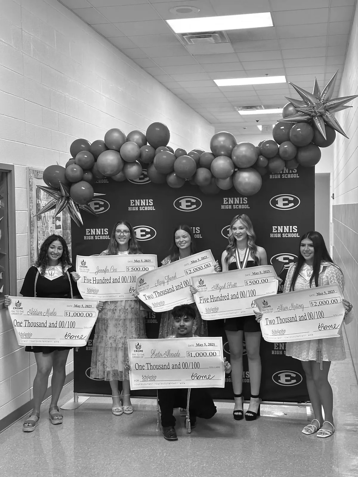 CROME scholarship recipients celebrating their awards at Ennis High School, in black and white